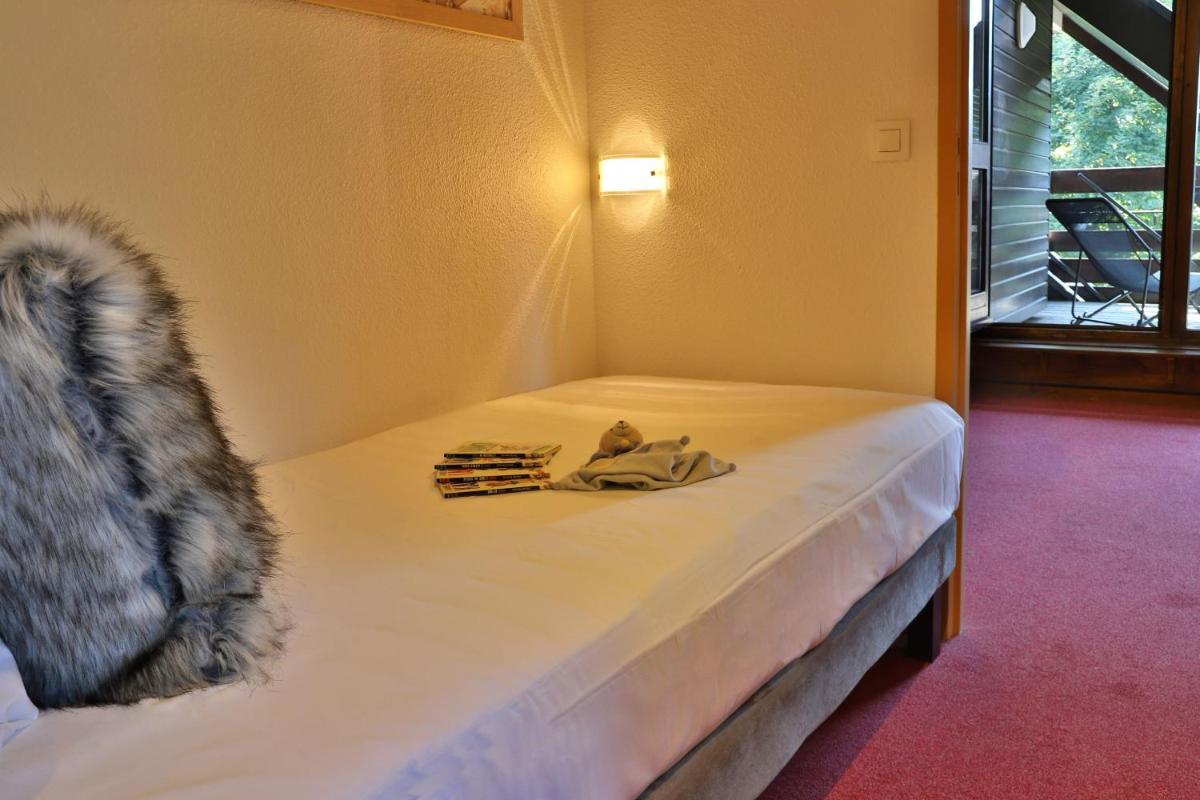 Un ou plusieurs lits dans un hébergement de l'établissement SOWELL HOTELS Mont Blanc et SPA