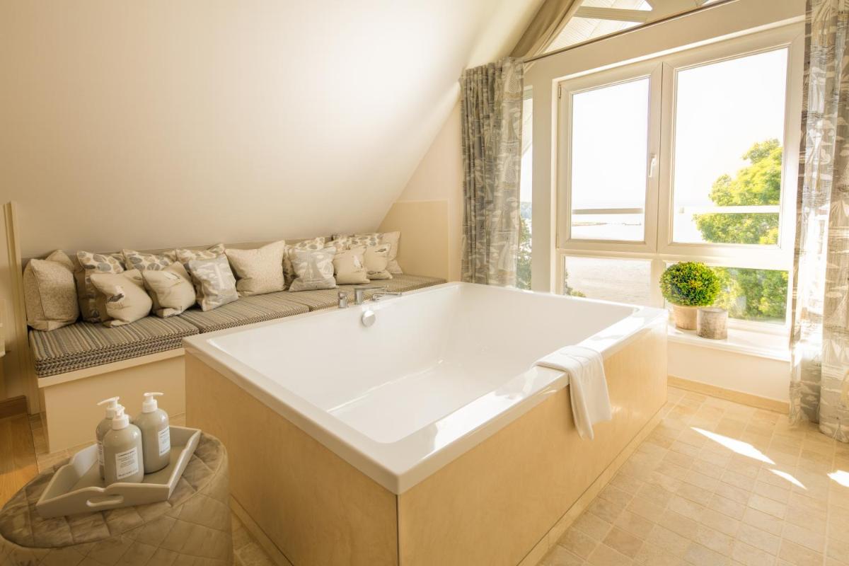 Ein Bett oder Betten in einem Zimmer der Unterkunft Alter Meierhof Glücksburg