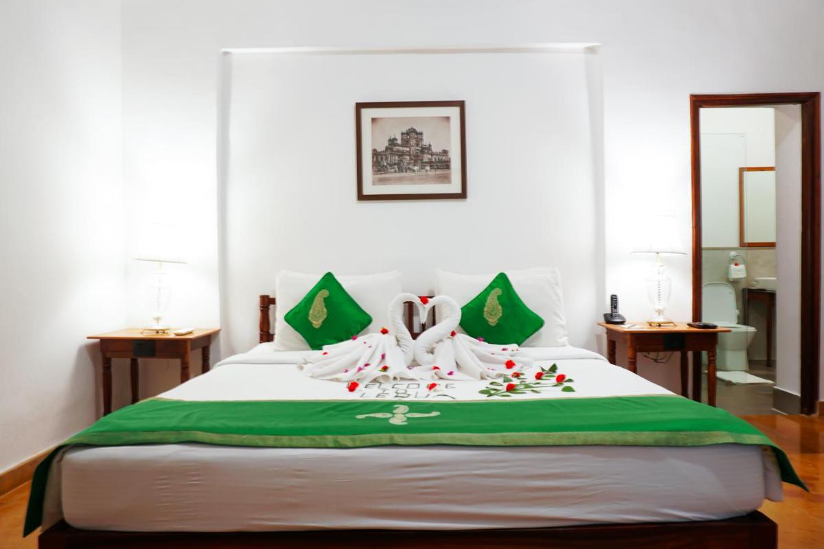 a bedroom with a bed with christmas decorations on it at Saraca Hotel Lucknow in Lucknow