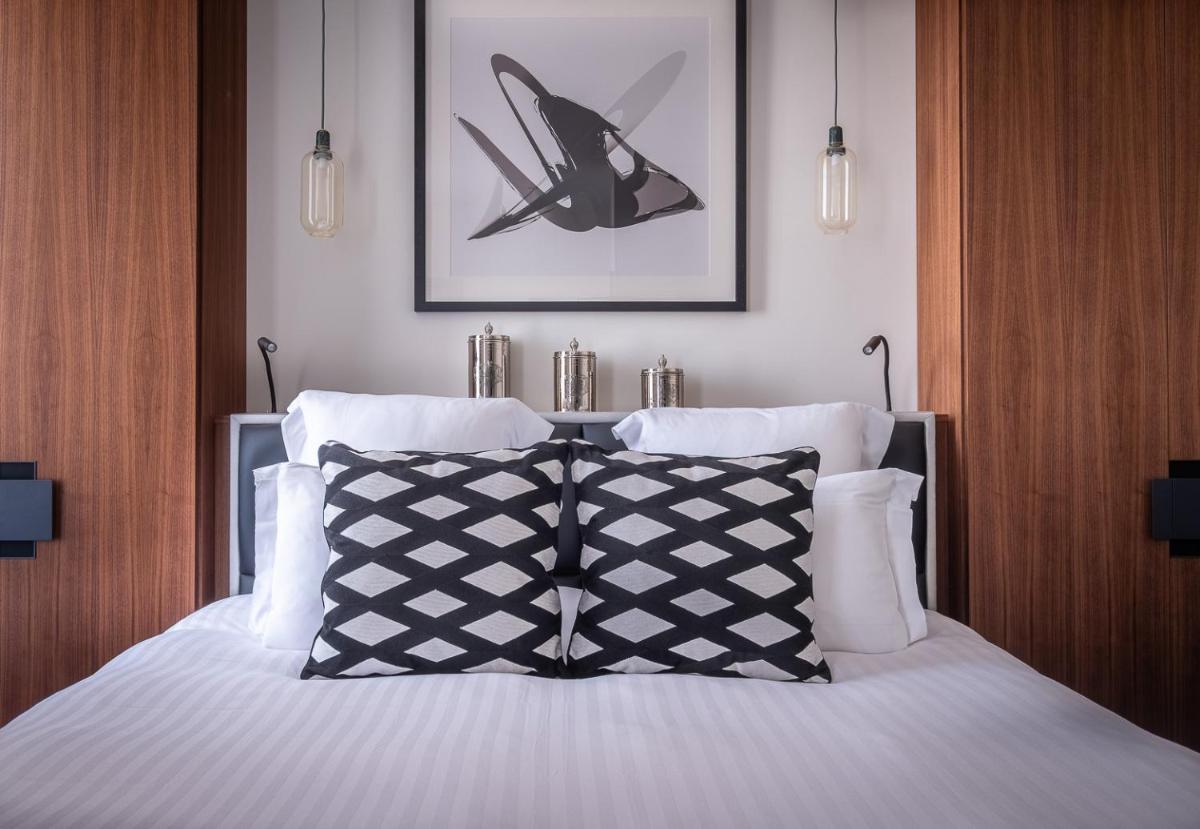 Un ou plusieurs lits dans un hébergement de l'établissement Le Boutique Hotel & Spa
