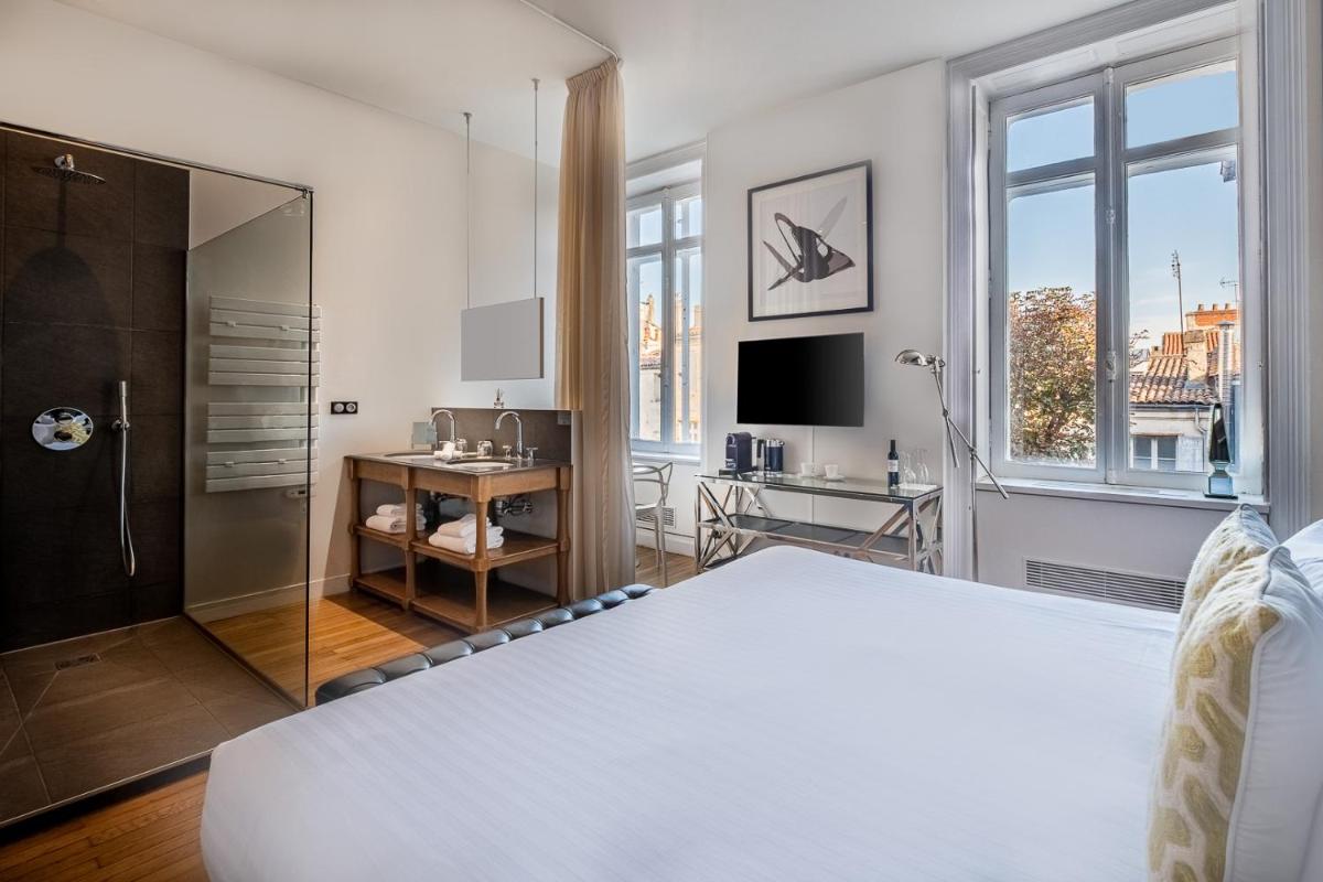 Un ou plusieurs lits dans un hébergement de l'établissement Le Boutique Hotel & Spa