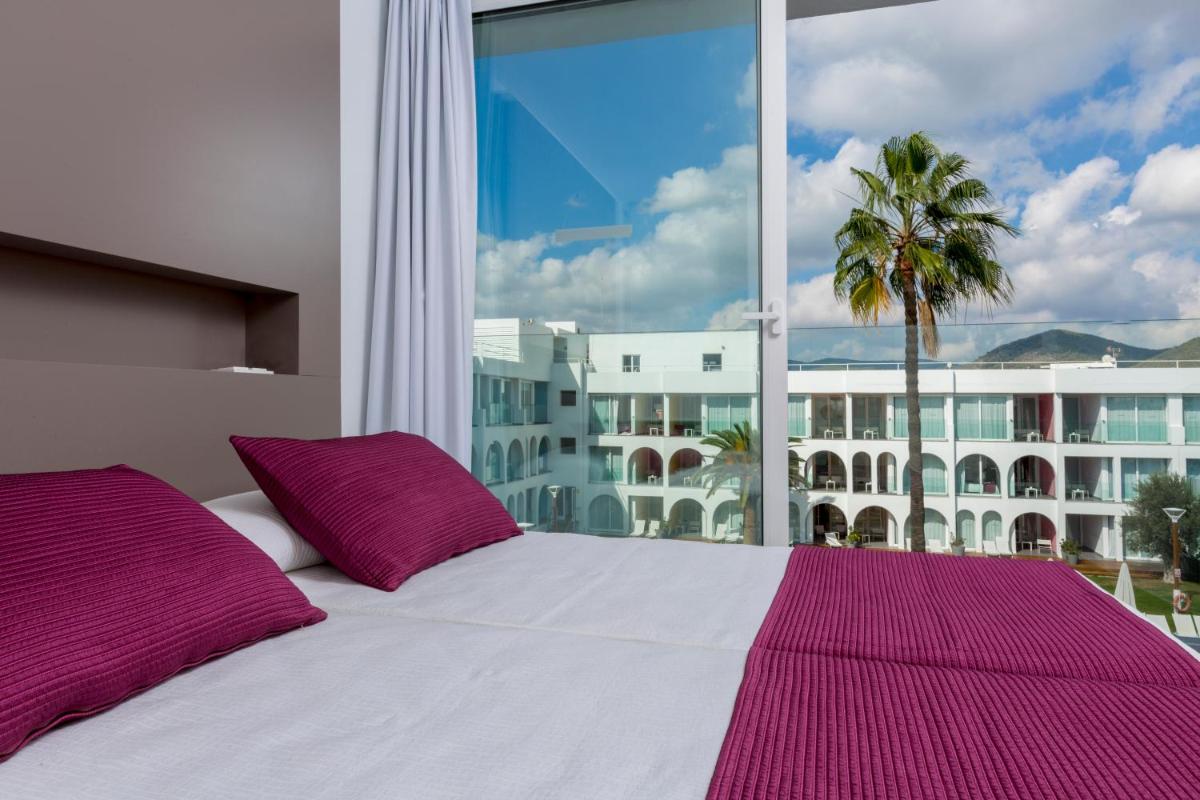 Cama o camas de una habitación en Ebano Hotel Apartments & Spa