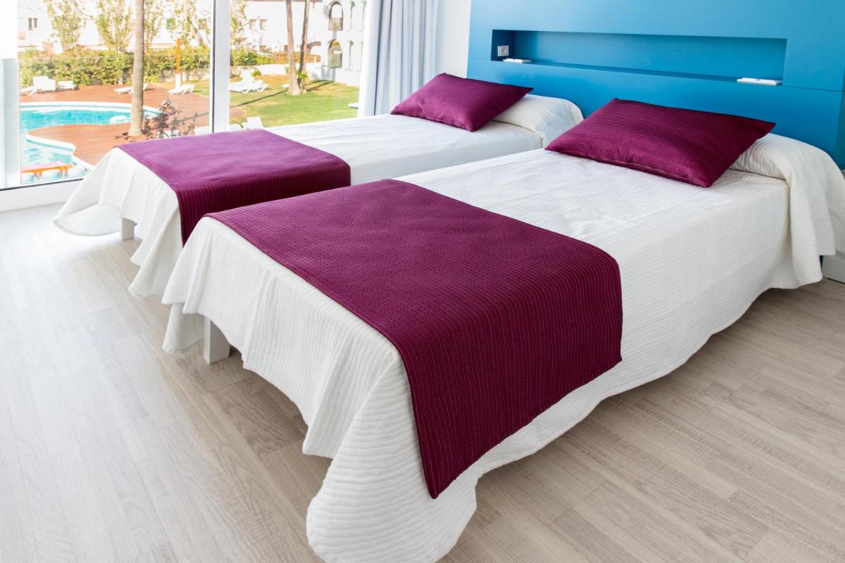 Cama o camas de una habitación en Ebano Hotel Apartments & Spa