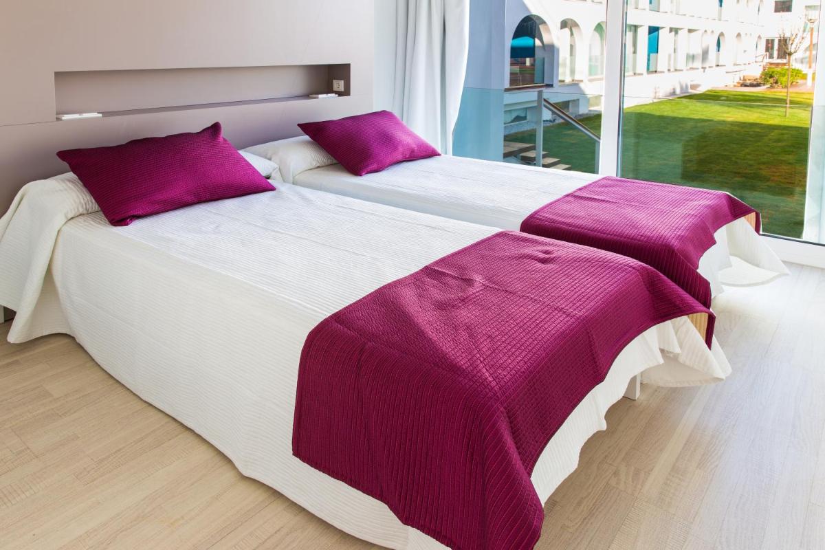 Cama o camas de una habitación en Ebano Hotel Apartments & Spa