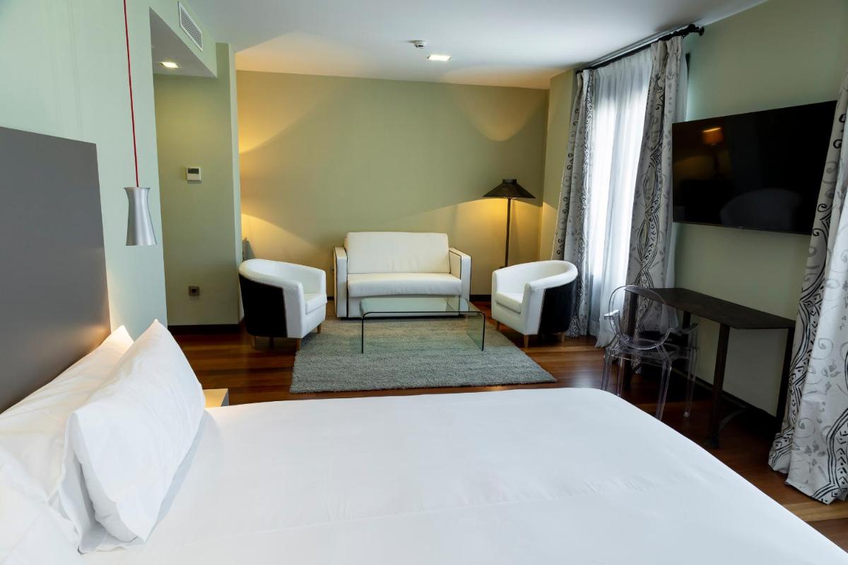 Cama o camas de una habitación en Hotel AR Isabel de Farnesio