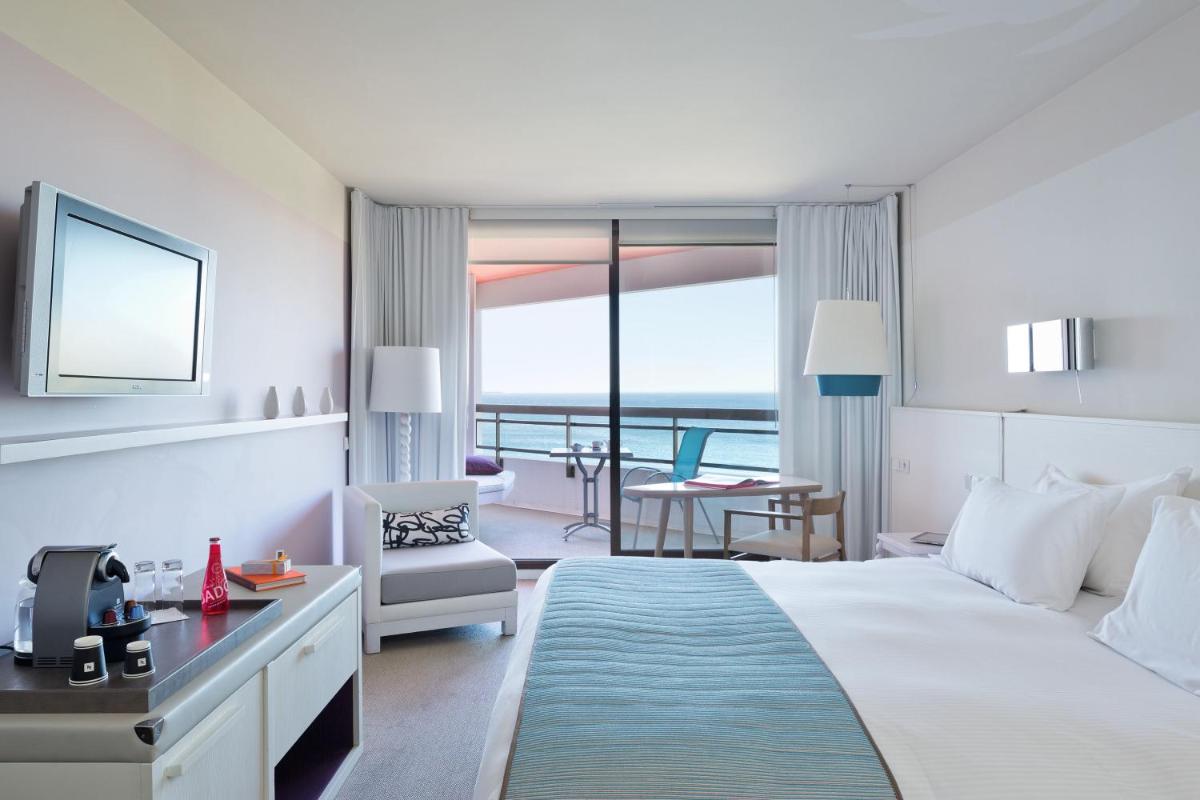 Un ou plusieurs lits dans un hébergement de l'établissement Pullman Cannes Mandelieu