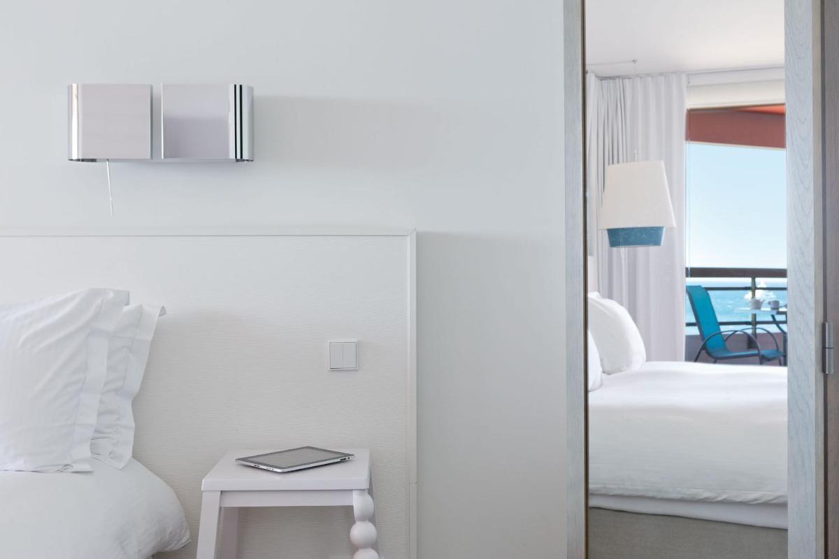 Un ou plusieurs lits dans un hébergement de l'établissement Pullman Cannes Mandelieu