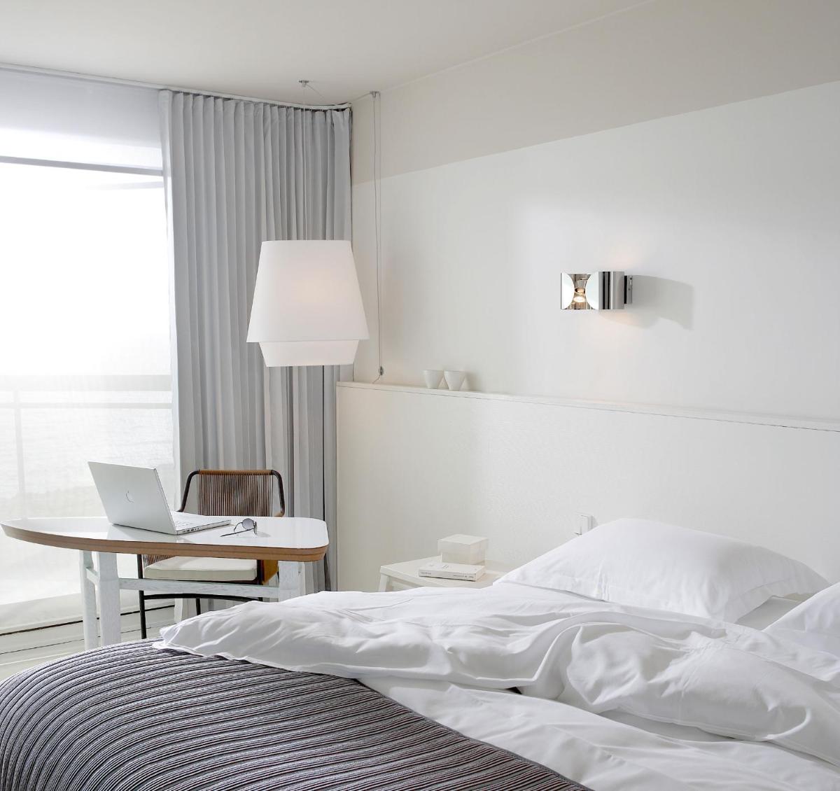 Un ou plusieurs lits dans un hébergement de l'établissement Pullman Cannes Mandelieu