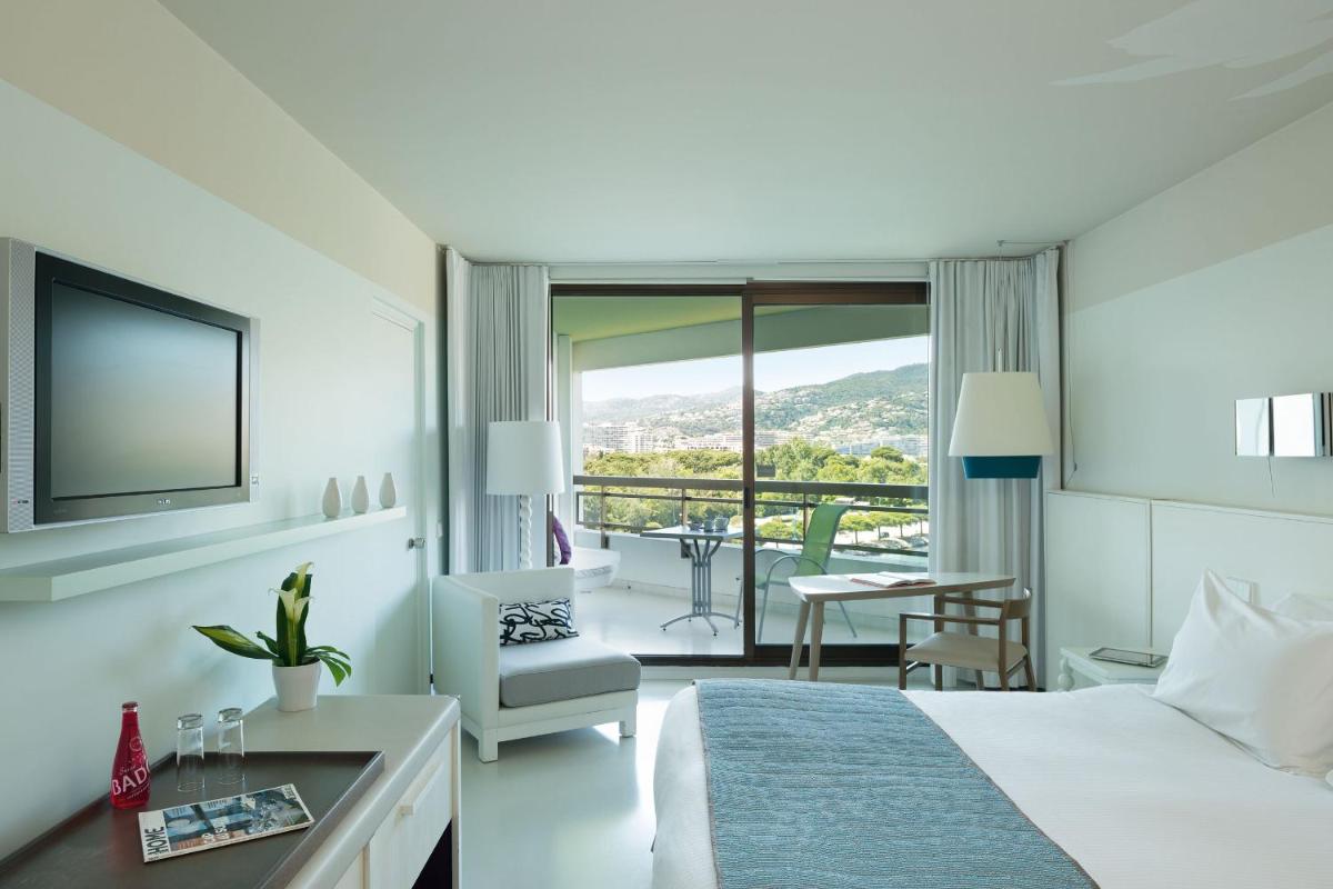 Un ou plusieurs lits dans un hébergement de l'établissement Pullman Cannes Mandelieu