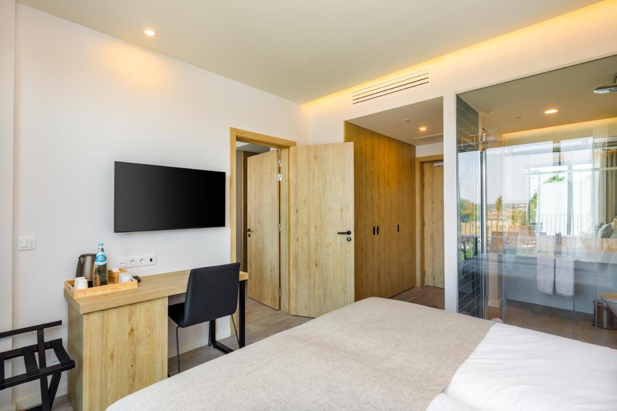 Uma televisão e/ou sistema de entretenimento em AP Cabanas Beach & Nature - Adults Friendly