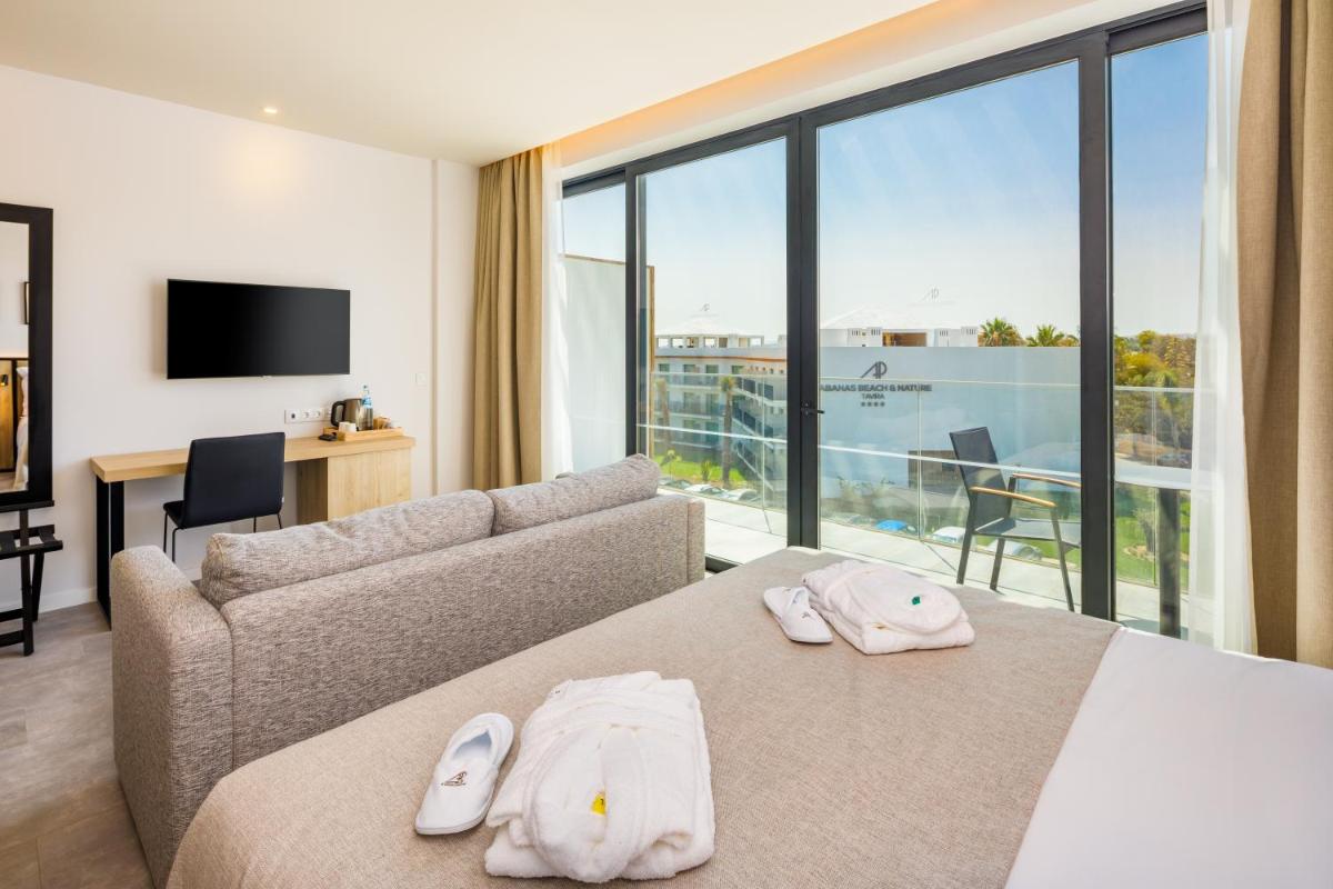 Uma televisão e/ou sistema de entretenimento em AP Cabanas Beach & Nature - Adults Friendly