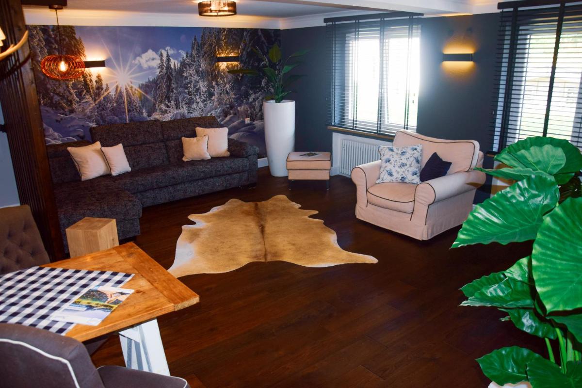 Ein Sitzbereich in der Unterkunft ALPENLIEBE - Sauna & Whirlpool - APARTments