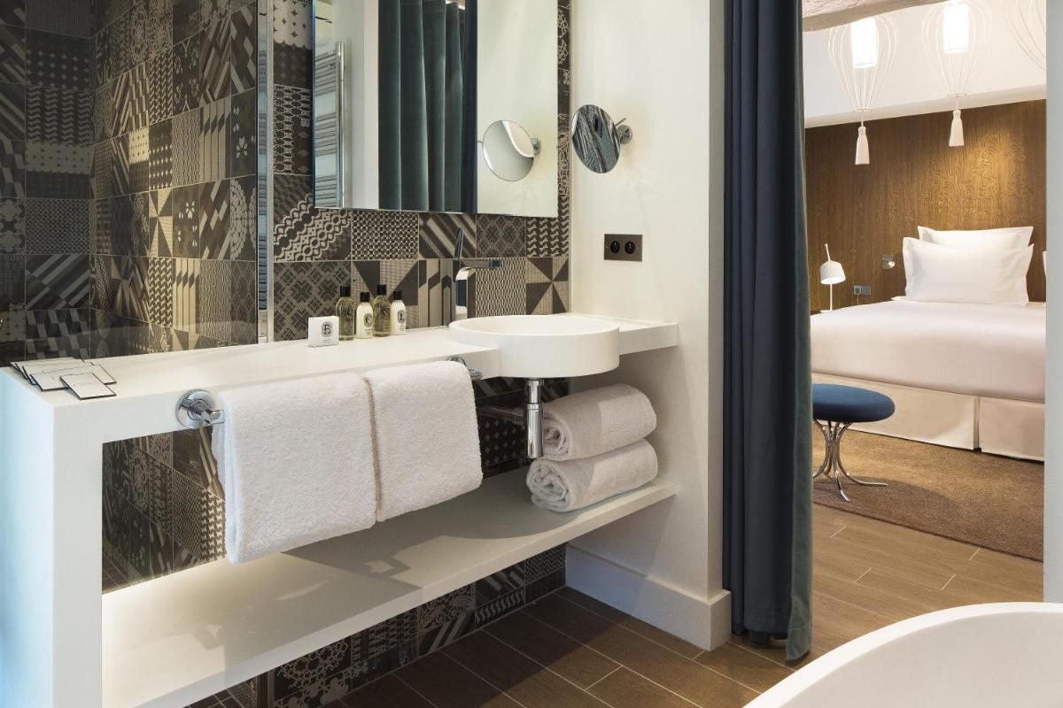 Un ou plusieurs lits dans un hébergement de l'établissement Hotel Dupond-Smith