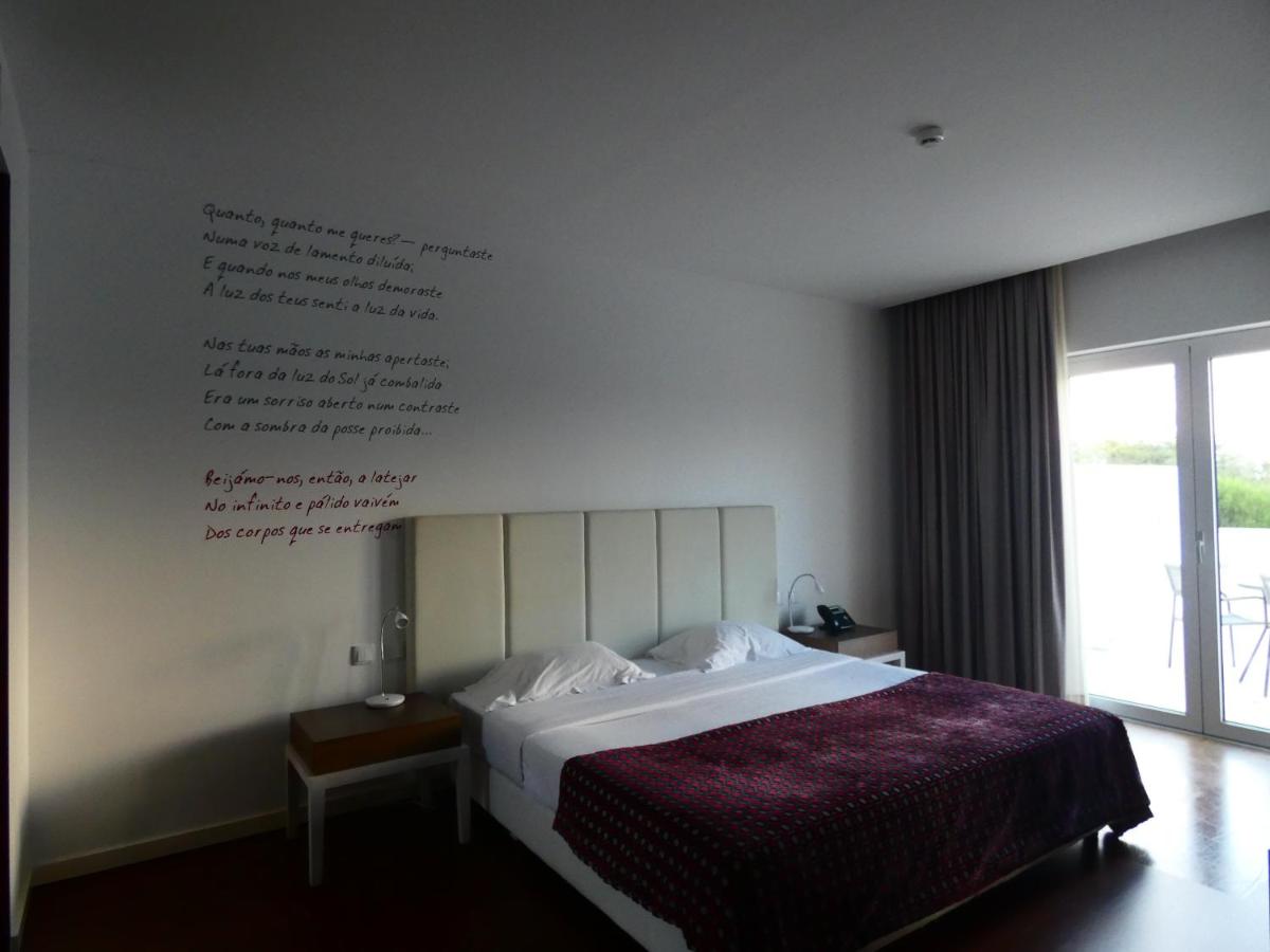 Uma cama ou camas num quarto em Hotel Vila D'Óbidos