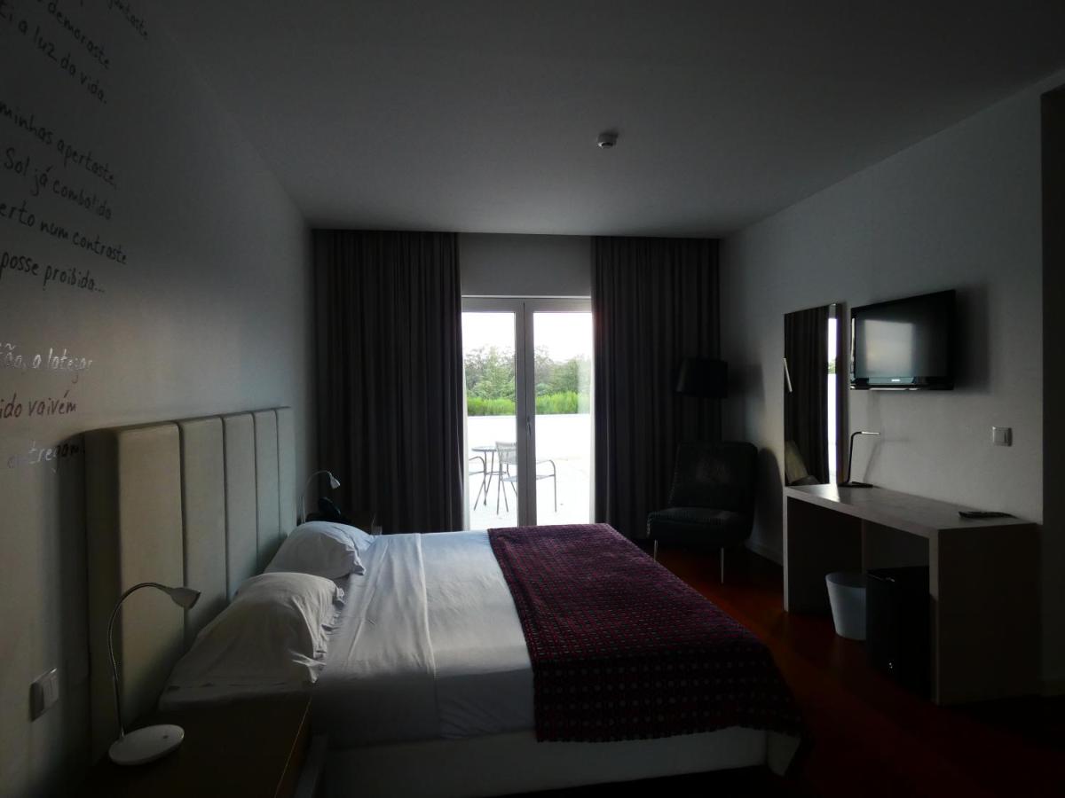 Uma cama ou camas num quarto em Hotel Vila D'Óbidos