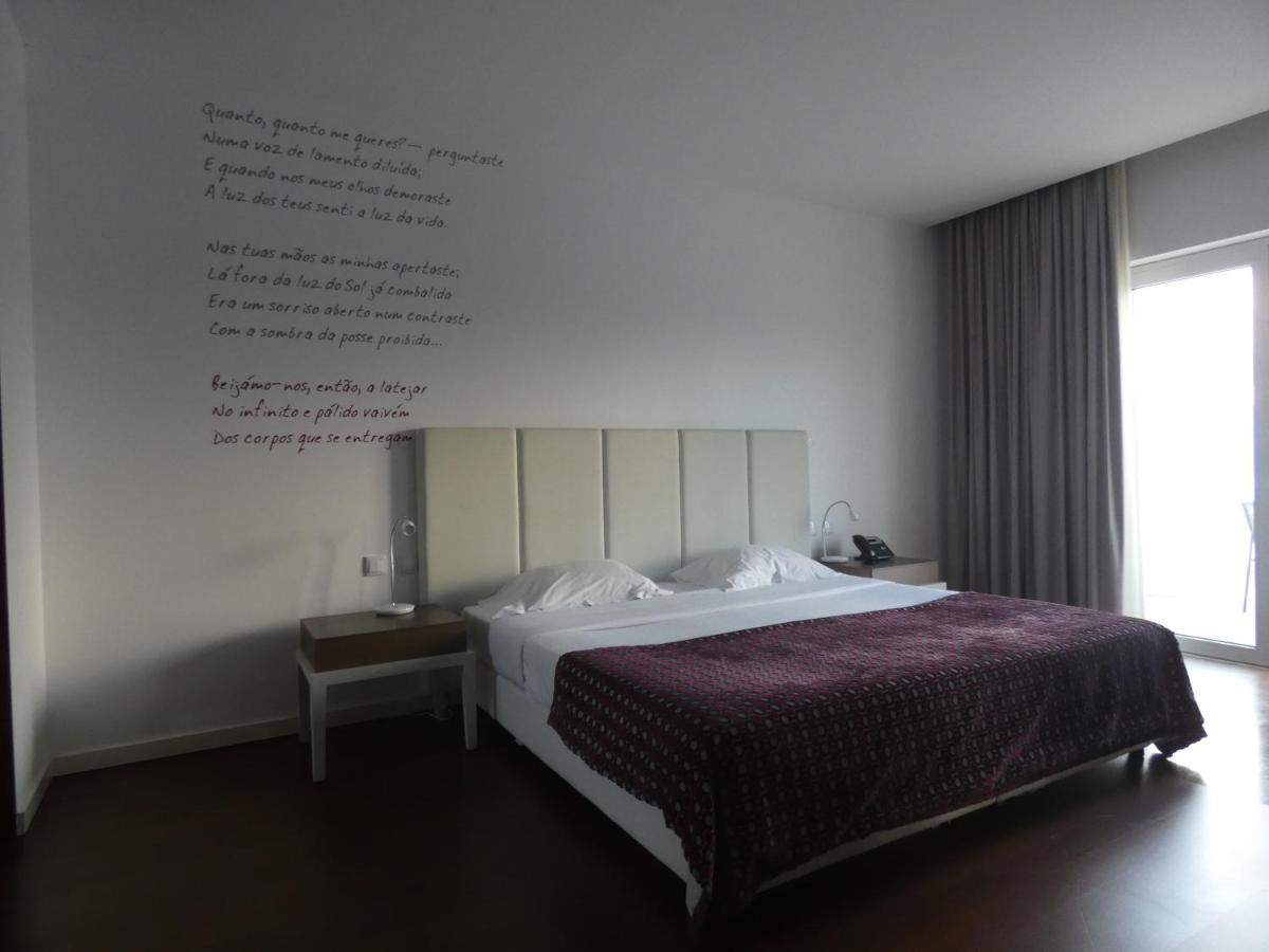 Uma cama ou camas num quarto em Hotel Vila D'Óbidos