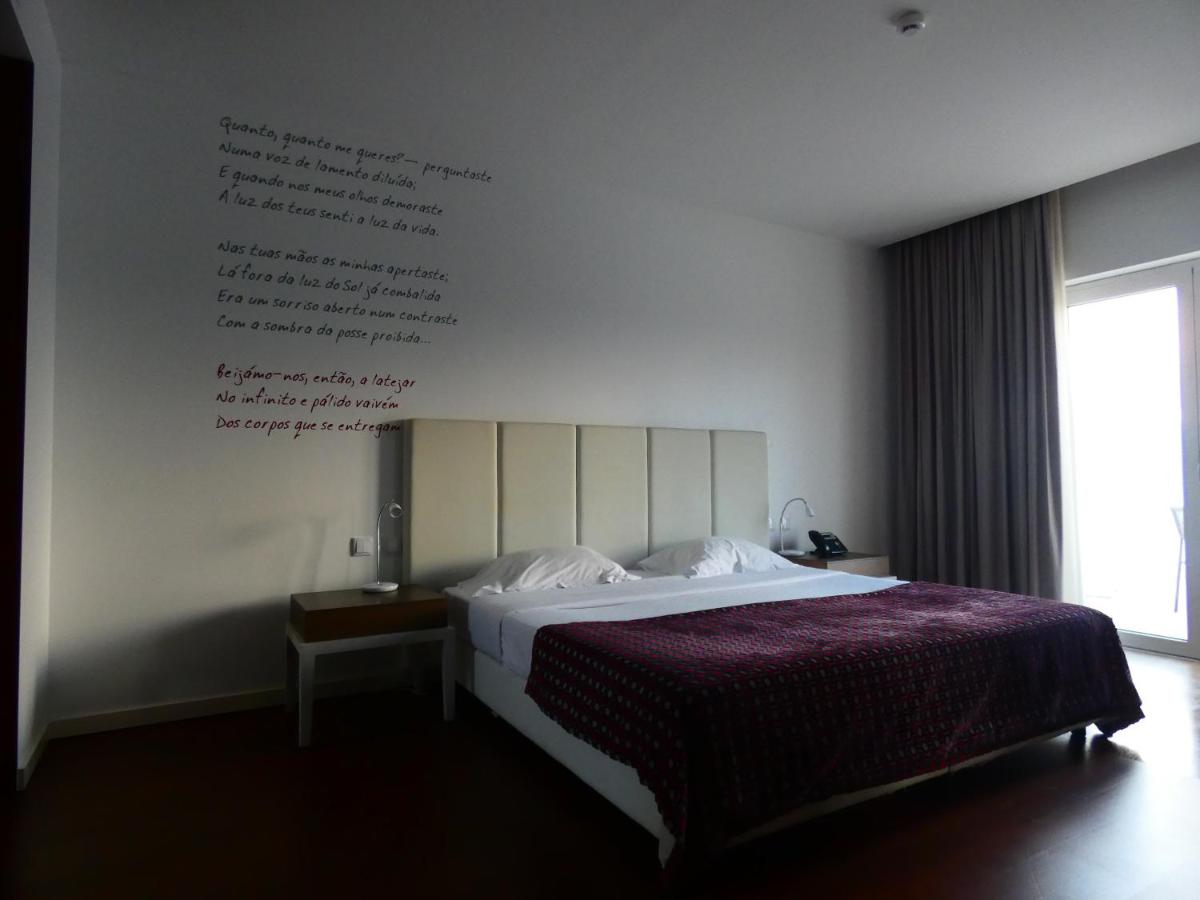 Uma cama ou camas num quarto em Hotel Vila D'Óbidos
