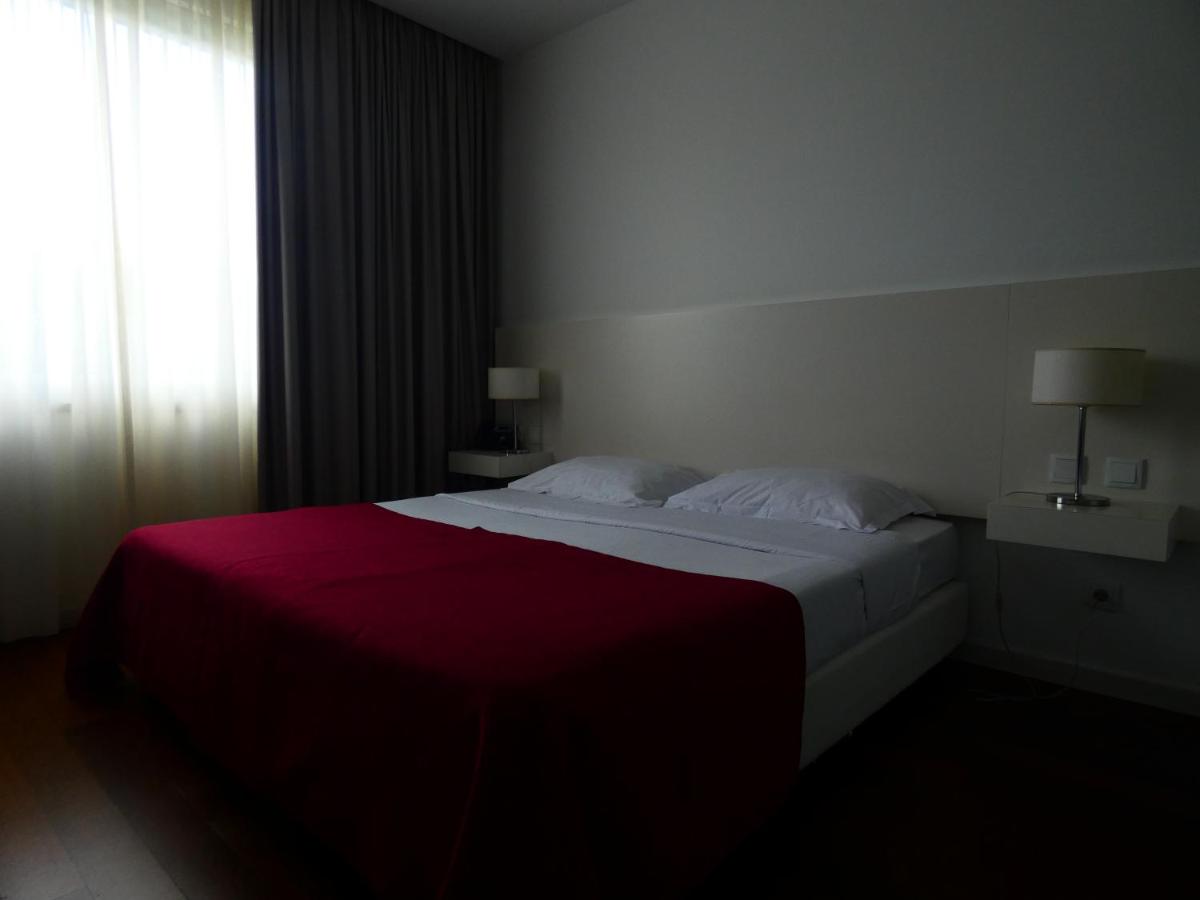 Uma cama ou camas num quarto em Hotel Vila D'Óbidos