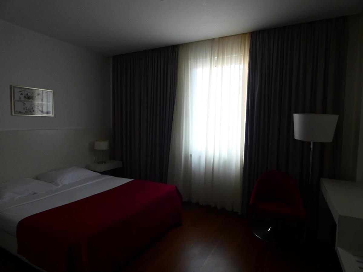 Uma cama ou camas num quarto em Hotel Vila D'Óbidos