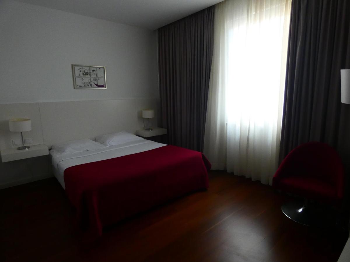 Uma cama ou camas num quarto em Hotel Vila D'Óbidos