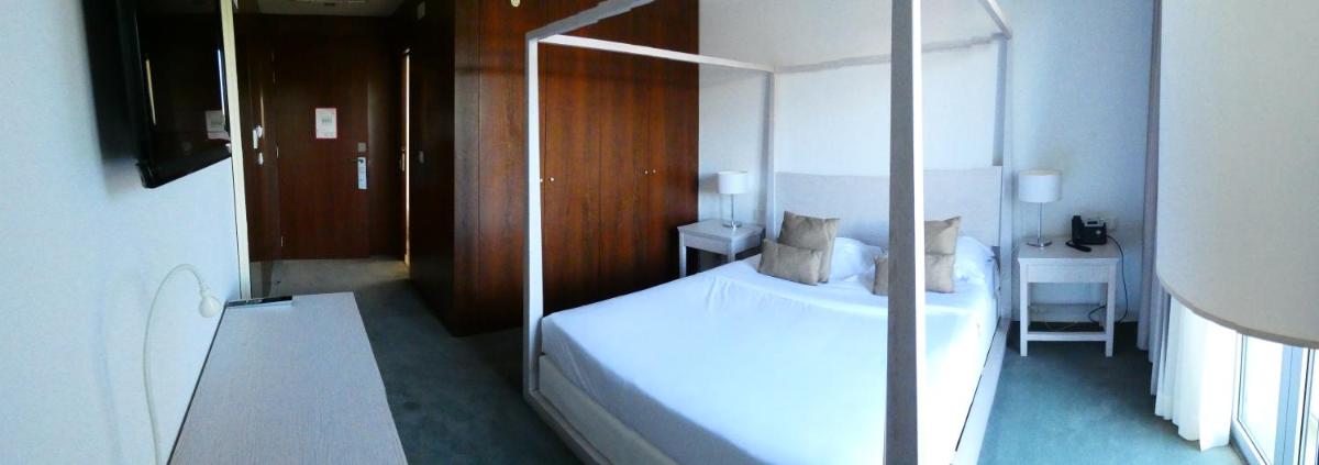 Uma cama ou camas num quarto em Hotel Vila D'Óbidos