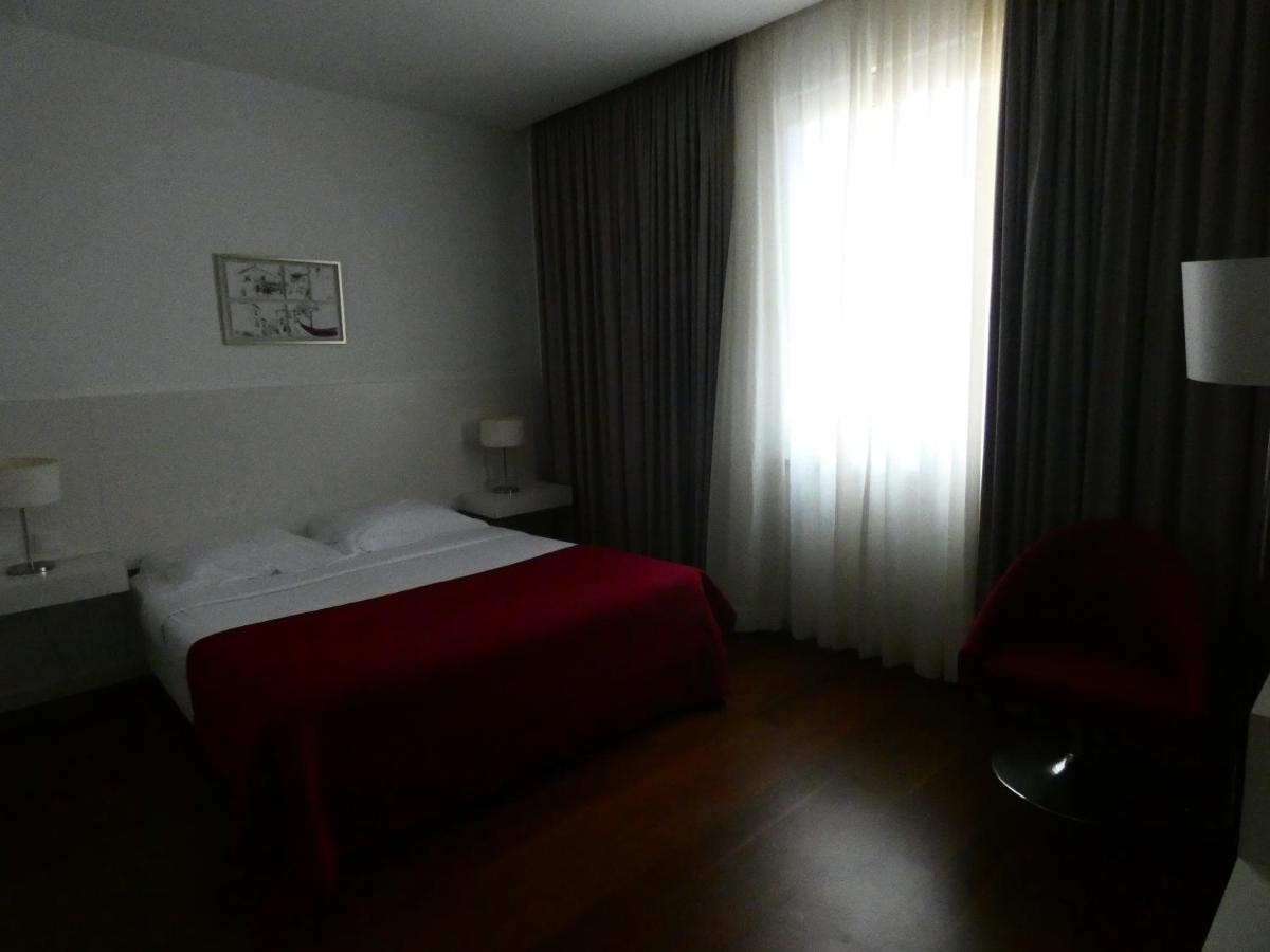 Uma cama ou camas num quarto em Hotel Vila D'Óbidos