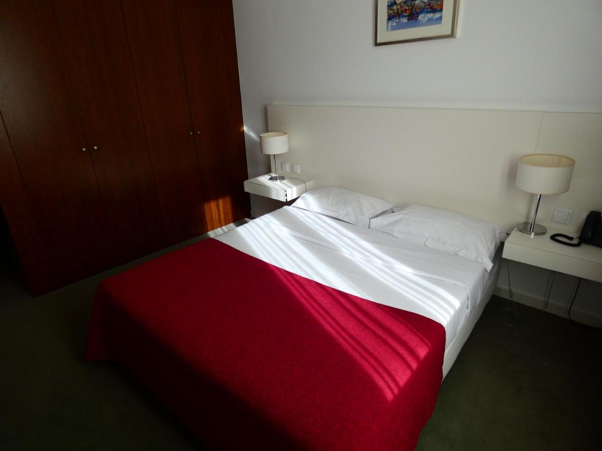 Uma cama ou camas num quarto em Hotel Vila D'Óbidos
