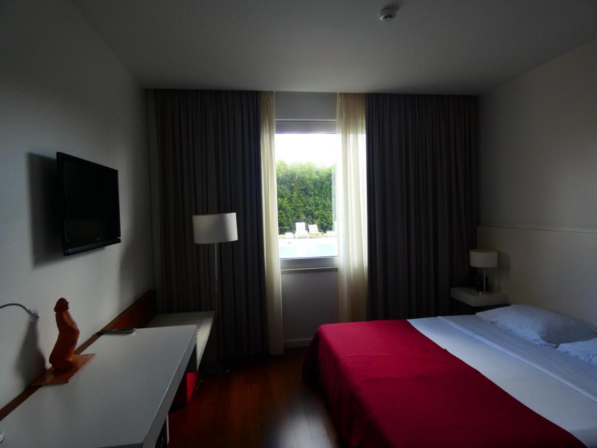 Uma cama ou camas num quarto em Hotel Vila D'Óbidos