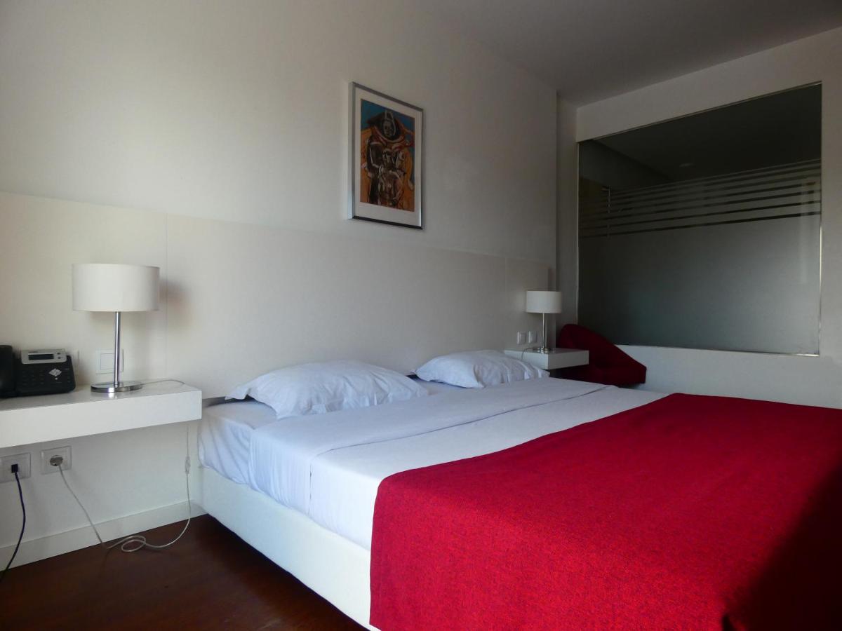 Uma cama ou camas num quarto em Hotel Vila D'Óbidos