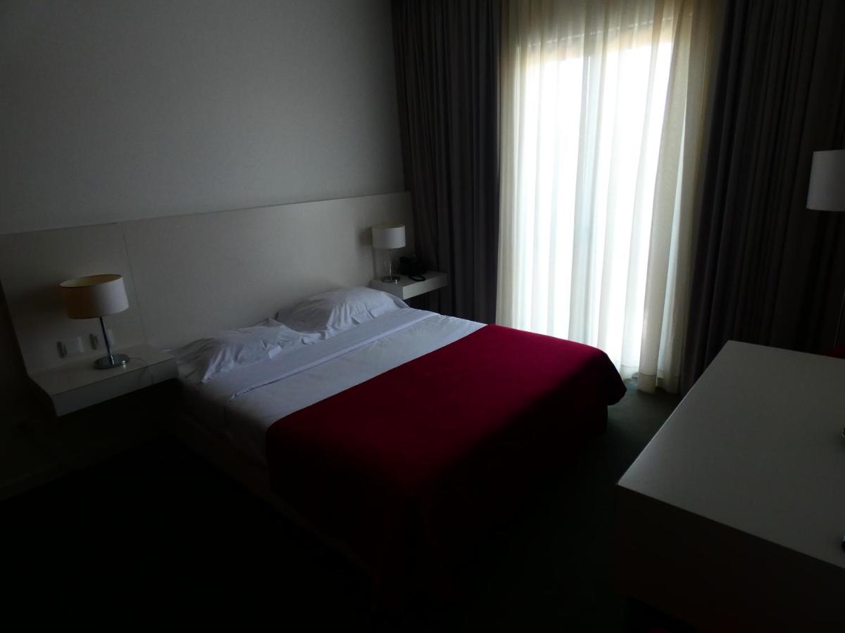 Uma cama ou camas num quarto em Hotel Vila D'Óbidos
