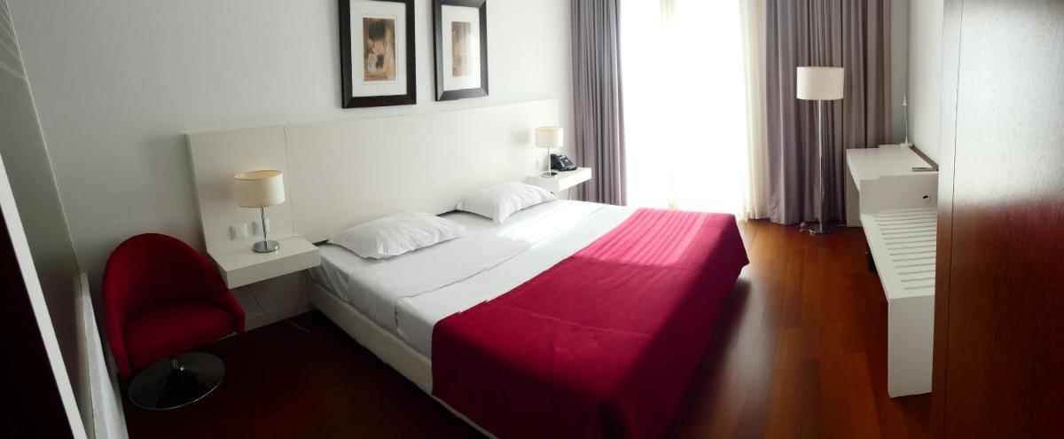 Uma cama ou camas num quarto em Hotel Vila D'Óbidos