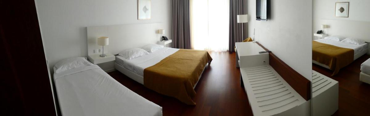 Uma cama ou camas num quarto em Hotel Vila D'Óbidos