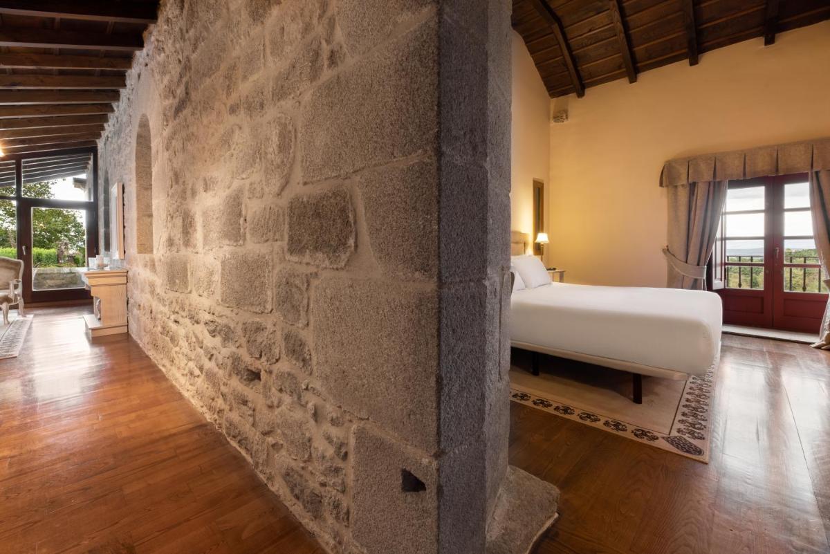 Cama o camas de una habitación en Áurea Palacio de Sober by Eurostars Hotel Company