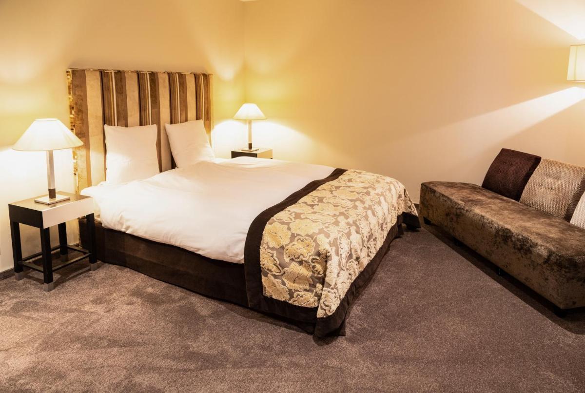 Un ou plusieurs lits dans un hébergement de l'établissement 6717 Nature Hôtel & Spa Le Clos des Délices