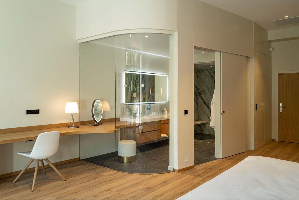 Un ou plusieurs lits dans un hébergement de l'établissement 6717 Nature Hôtel & Spa Le Clos des Délices
