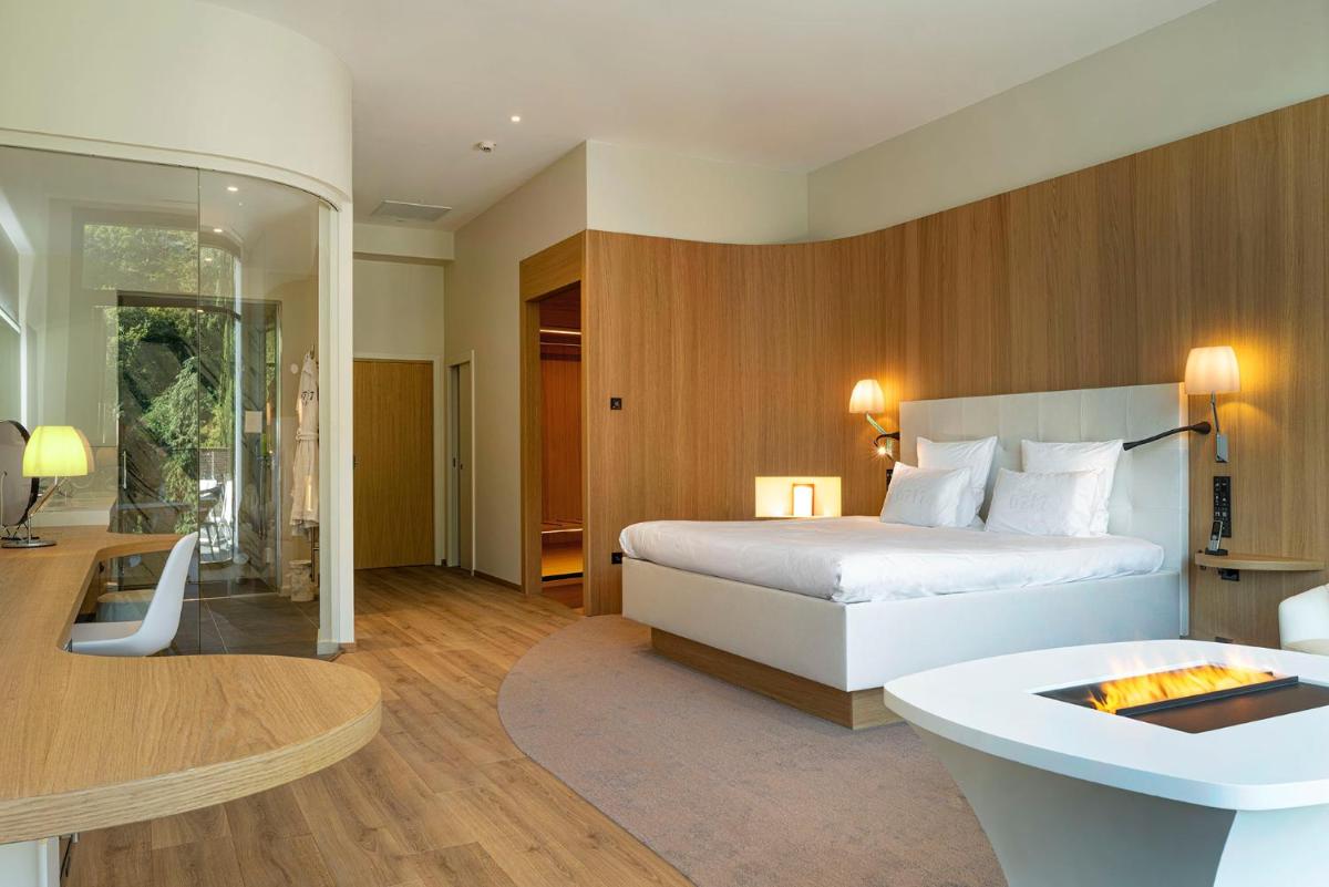 Un ou plusieurs lits dans un hébergement de l'établissement 6717 Nature Hôtel & Spa Le Clos des Délices