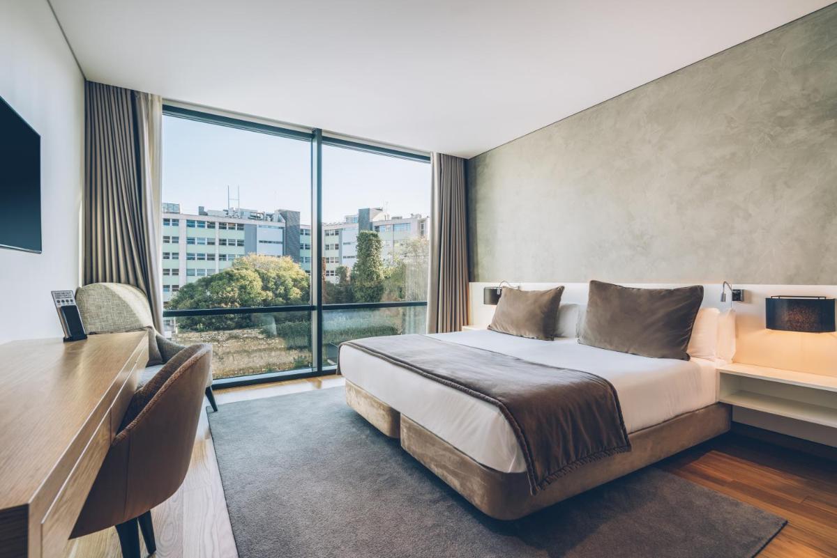 Uma cama ou camas num quarto em Iberostar Selection Lisboa