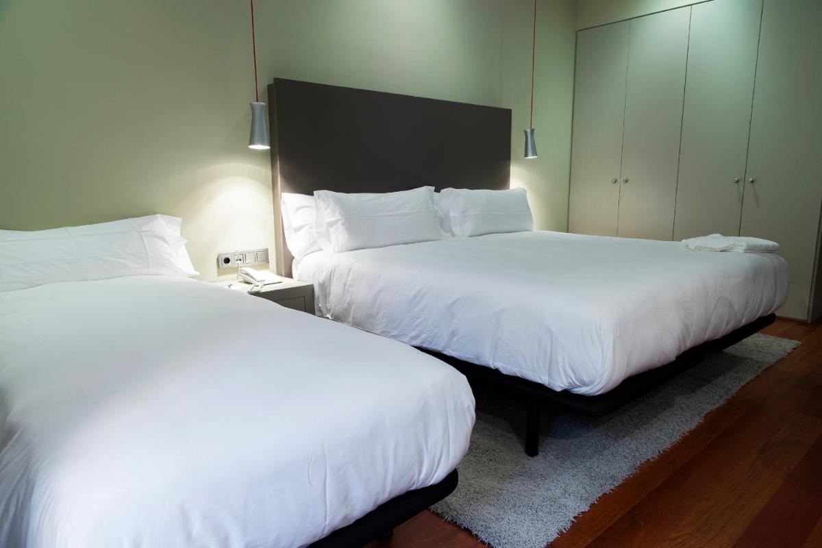 Cama o camas de una habitación en Hotel AR Isabel de Farnesio