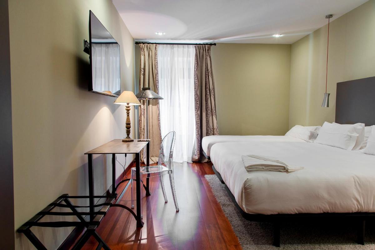 Cama o camas de una habitación en Hotel AR Isabel de Farnesio