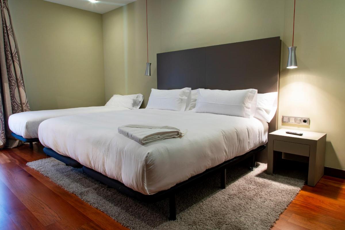 Cama o camas de una habitación en Hotel AR Isabel de Farnesio