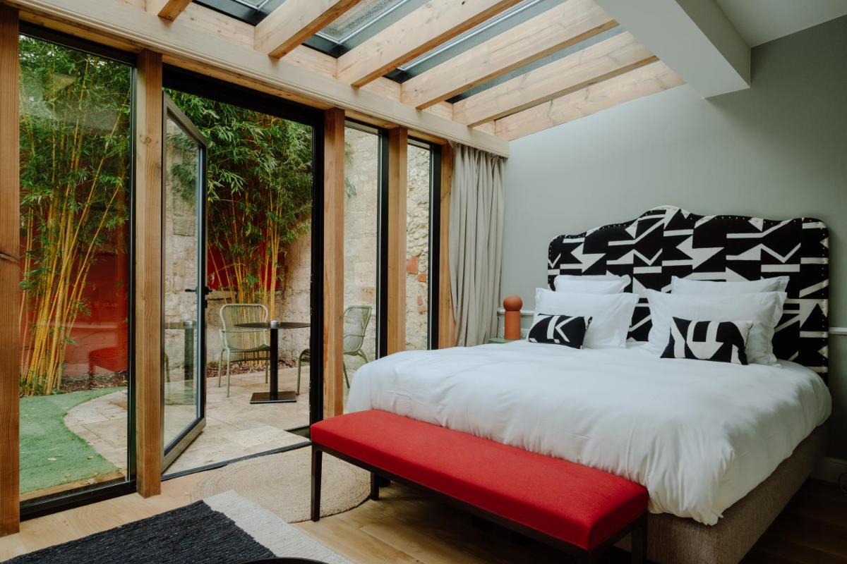 Un ou plusieurs lits dans un hébergement de l'établissement Hôtel Maison Pavlov - Restaurant & Spa - Bordeaux Bouscat