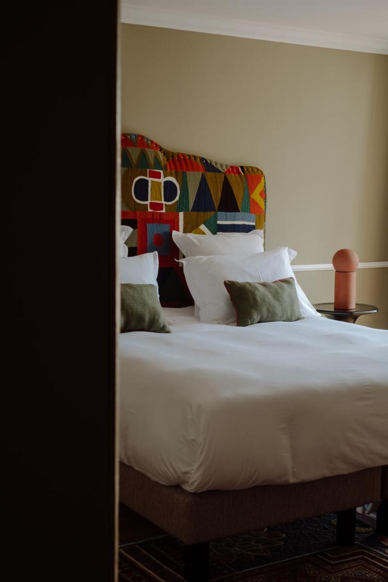 Un ou plusieurs lits dans un hébergement de l'établissement Hôtel Maison Pavlov - Restaurant & Spa - Bordeaux Bouscat