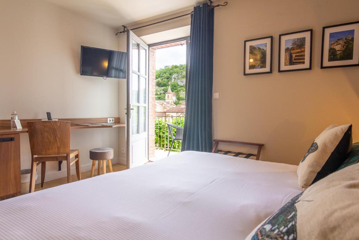 Un ou plusieurs lits dans un hébergement de l'établissement Hôtel Spa La Truite Dorée