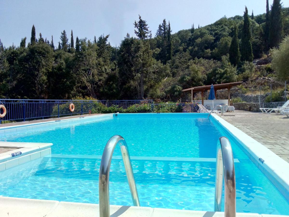 KAMINAKIA Apartments - Adults only policy - Sun drenched - Heavenly peaceful - A soothing oasis with a large swimming pool exclusively for guests' use - Sheltered on both sides by an evergreen cypress forest - Stunning sea views from every veranda - Housity