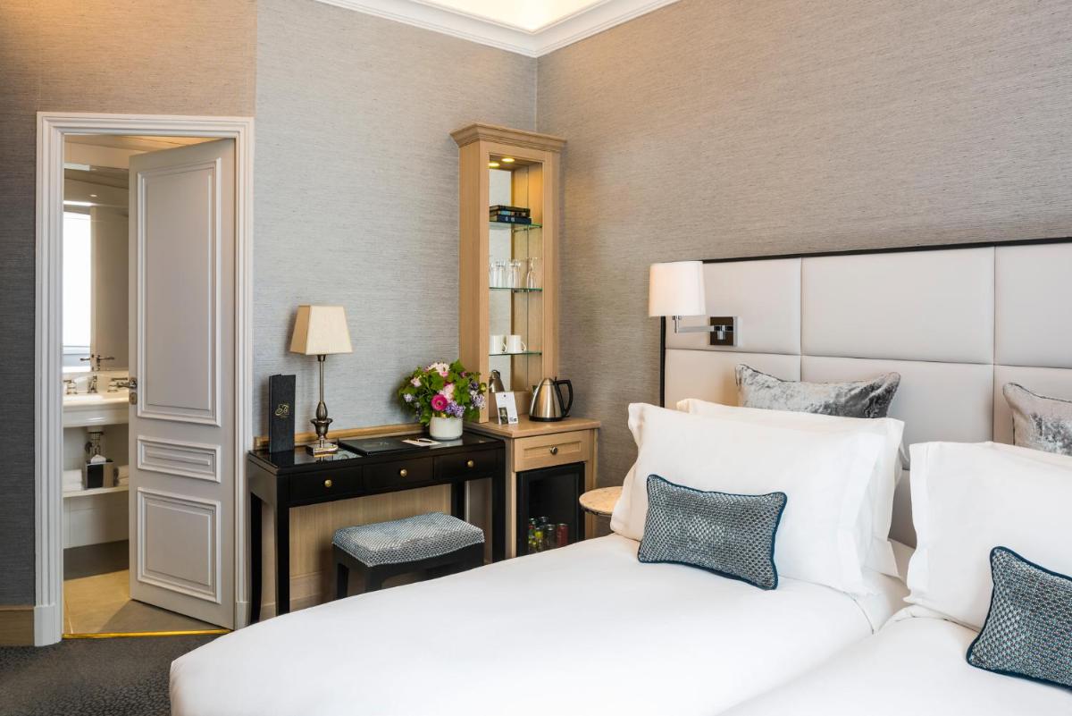 Un ou plusieurs lits dans un hébergement de l'établissement Sofitel Paris Baltimore Tour Eiffel
