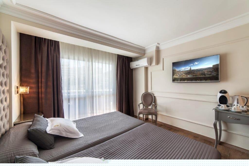 Cama o camas de una habitación en Essence Hotel Boutique