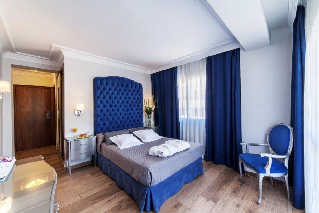Cama o camas de una habitación en Essence Hotel Boutique