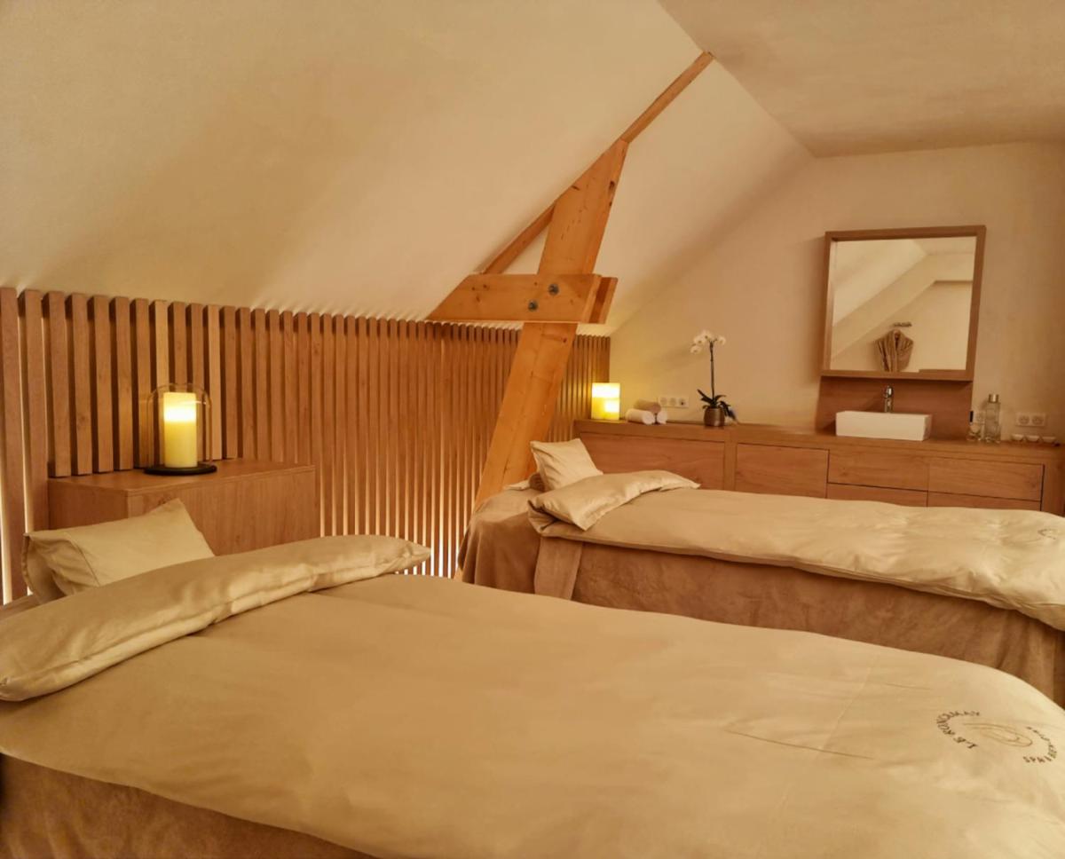 Un ou plusieurs lits dans un hébergement de l'établissement Domaine Du Roncemay - Hôtel, Restaurants, Spa & Golf