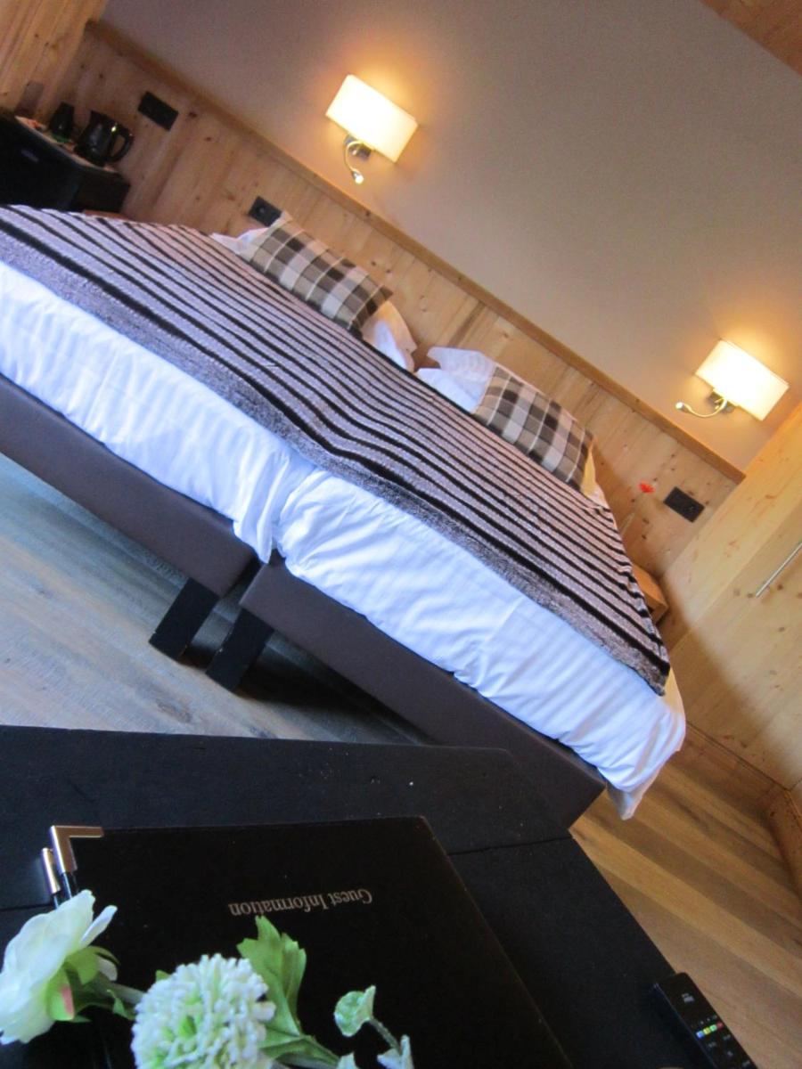 Un ou plusieurs lits dans un hébergement de l'établissement Logis Hotel Gai Soleil