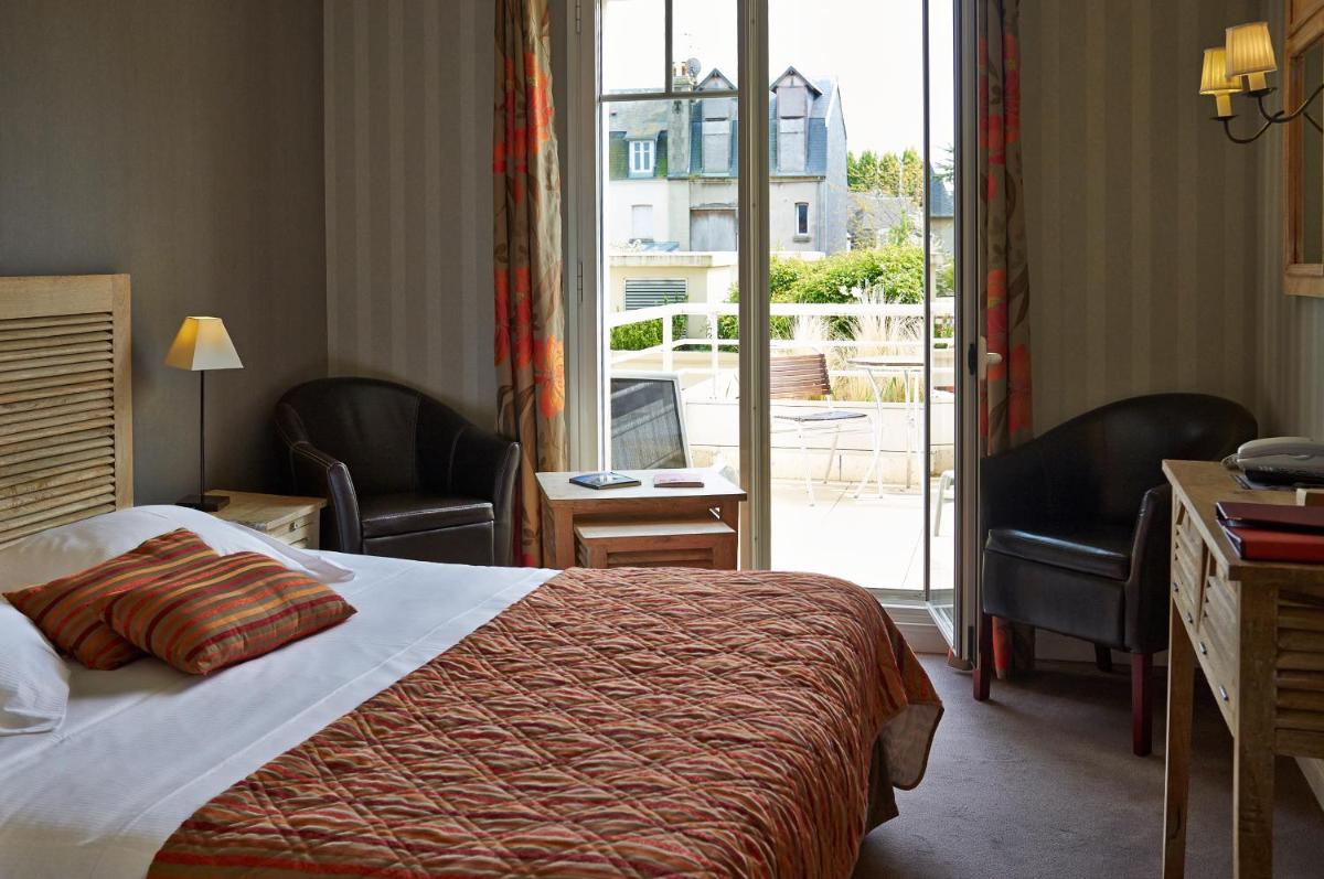 Un ou plusieurs lits dans un hébergement de l'établissement Almoria Hôtel & SPA